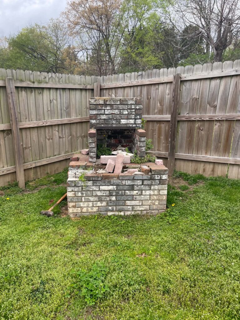 Outdoor brick fireplace before its removal