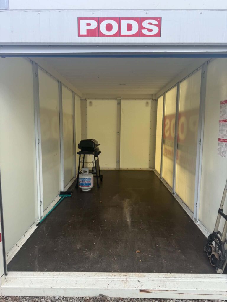 Open floor space inside the storage pod after an estate sale pickup