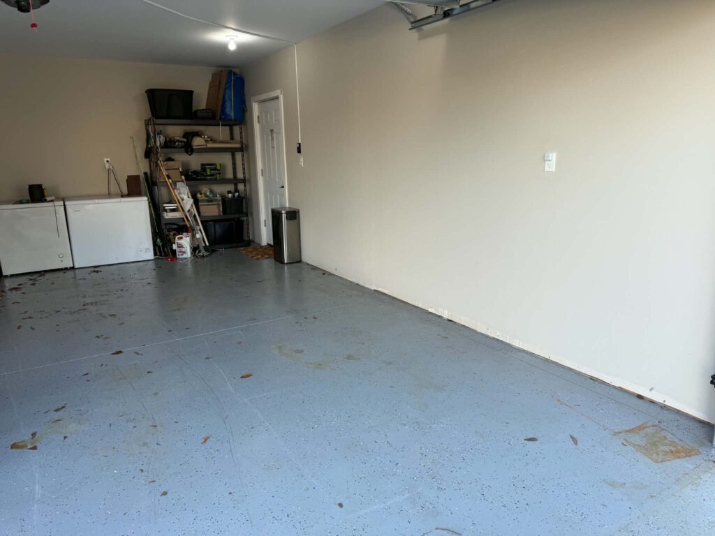 Garage floor space after unwanted furniture was removed