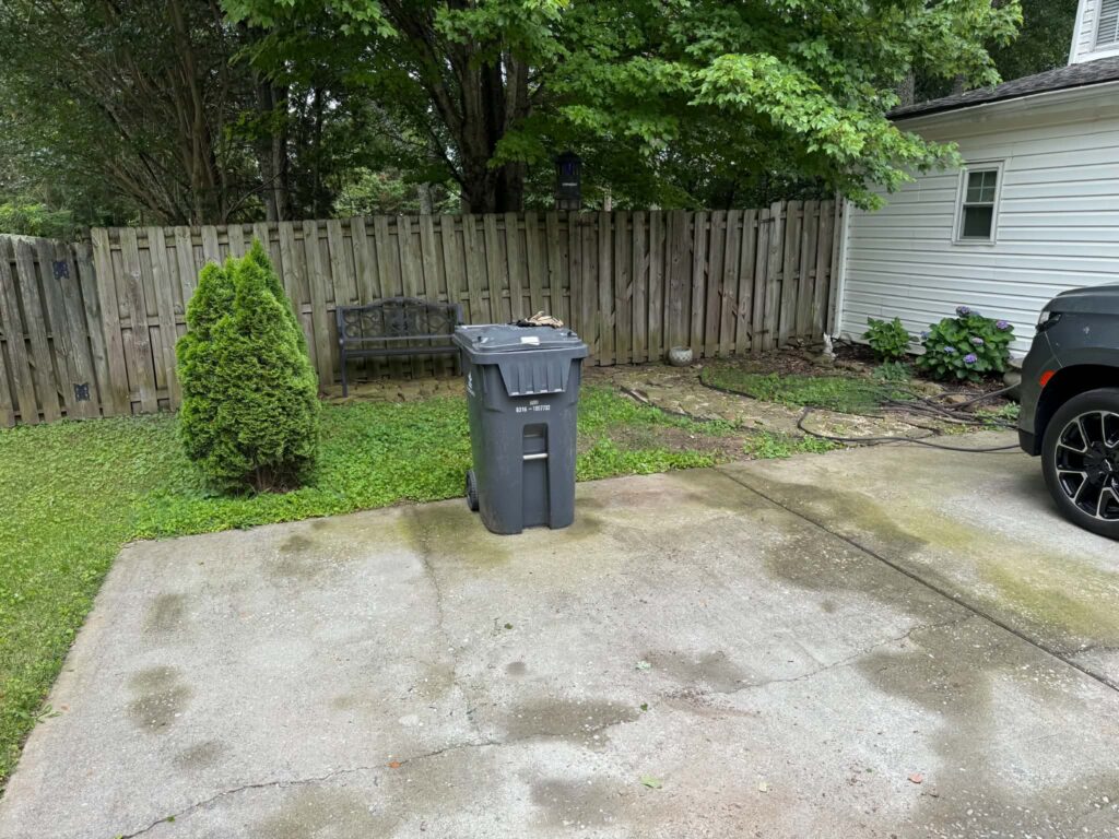 Paved area after the remodeling debris pile was hauled away.