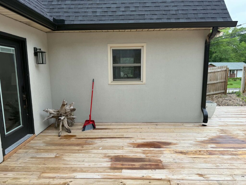 Wooden deck after the moving boxes and packing debris were removed.